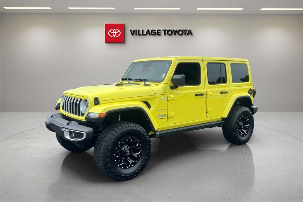 2024 Jeep Wrangler Sahara in High Velocity Clearcoat — front three-quarter view