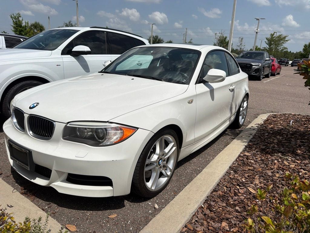 2013 BMW 1 Series 135i in Alpine White — front three-quarter view